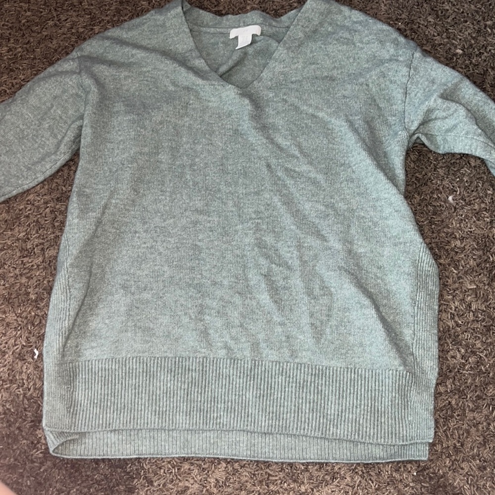 green sweater, slits on side